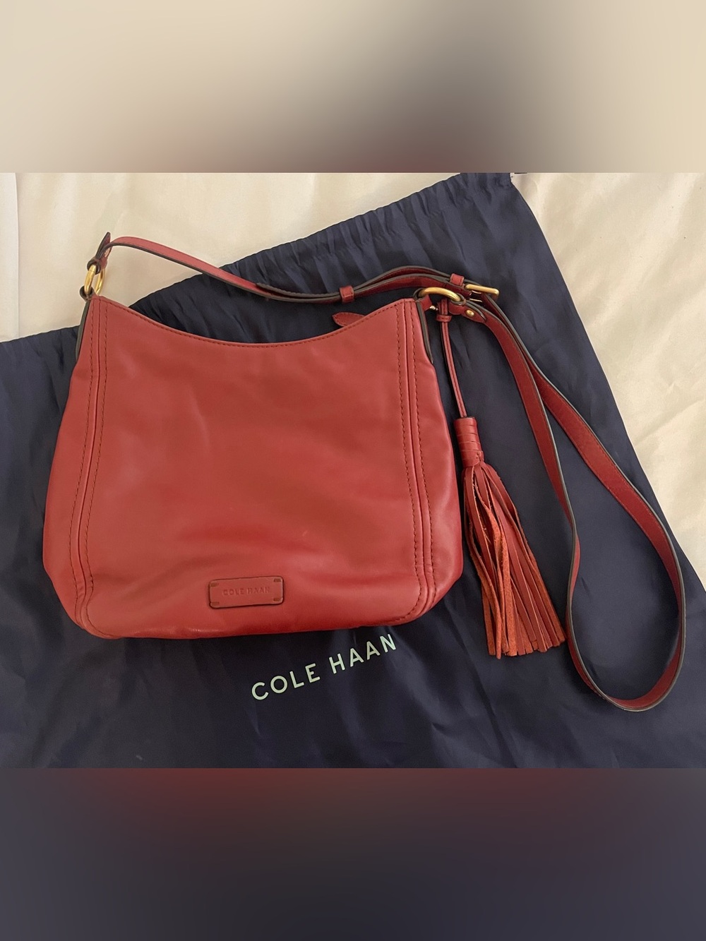 Cole Haan Maroon Leather Crossbody Bag with Tassel Accent